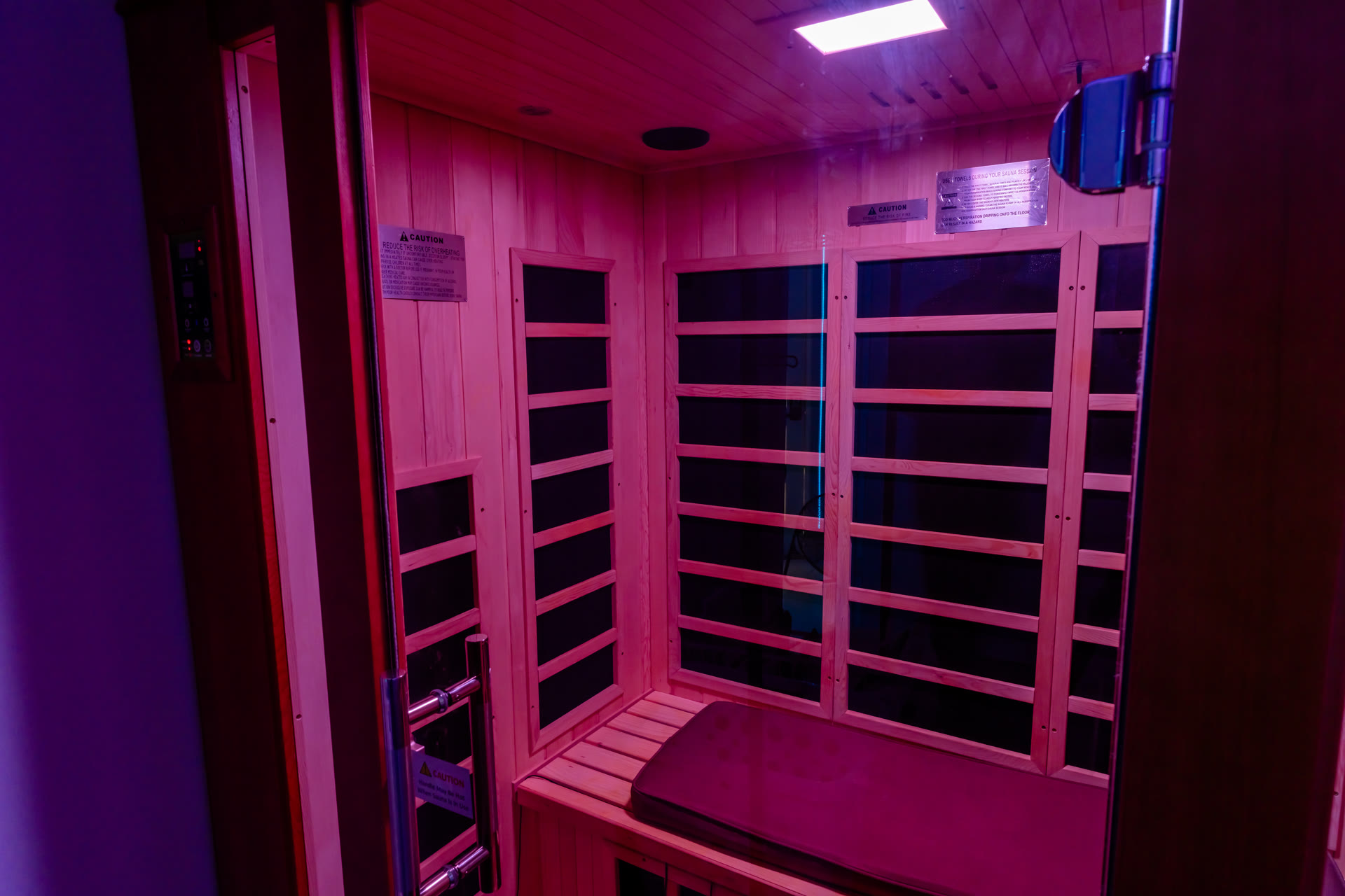 Inside the warm-lit sauna cabin at Wellness Elite Fitness