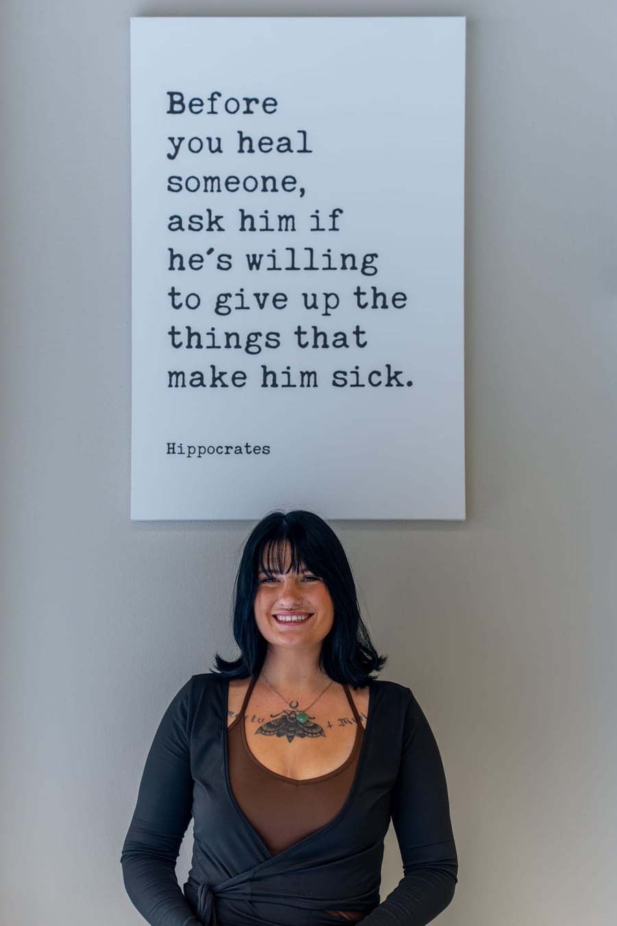 A Wellness Elite Fitness licensed personal trainer on the strength floor